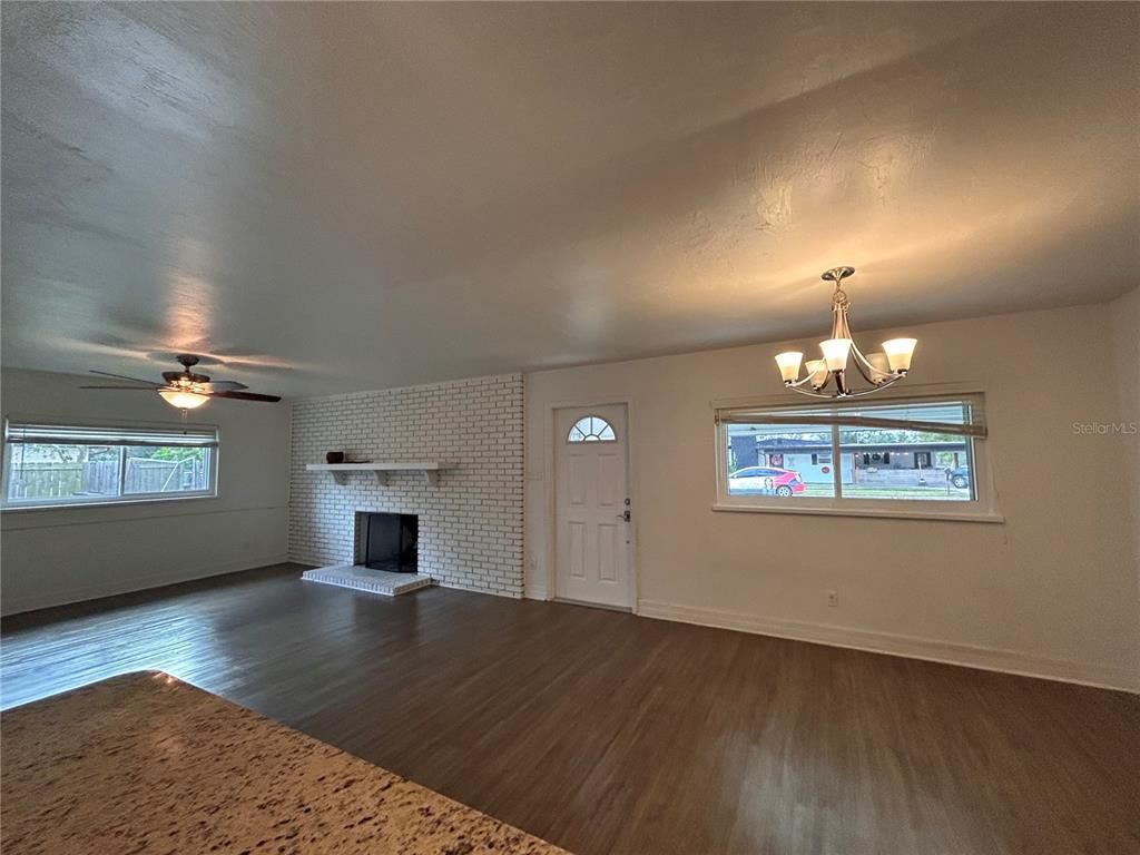 Chandelier, Empty room, Fireplace, Interior, Stone Walls, Wood Texture Flooring
