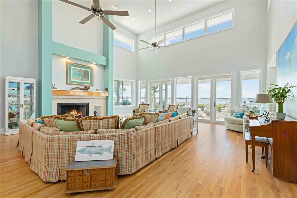 Fireplace, Interior, Living room, Piano, Recessed Lighting, Wood Texture Flooring