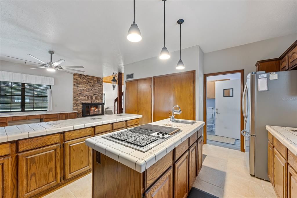 Fireplace, Interior, Kitchen, Pendant Lights, Tile Countertops