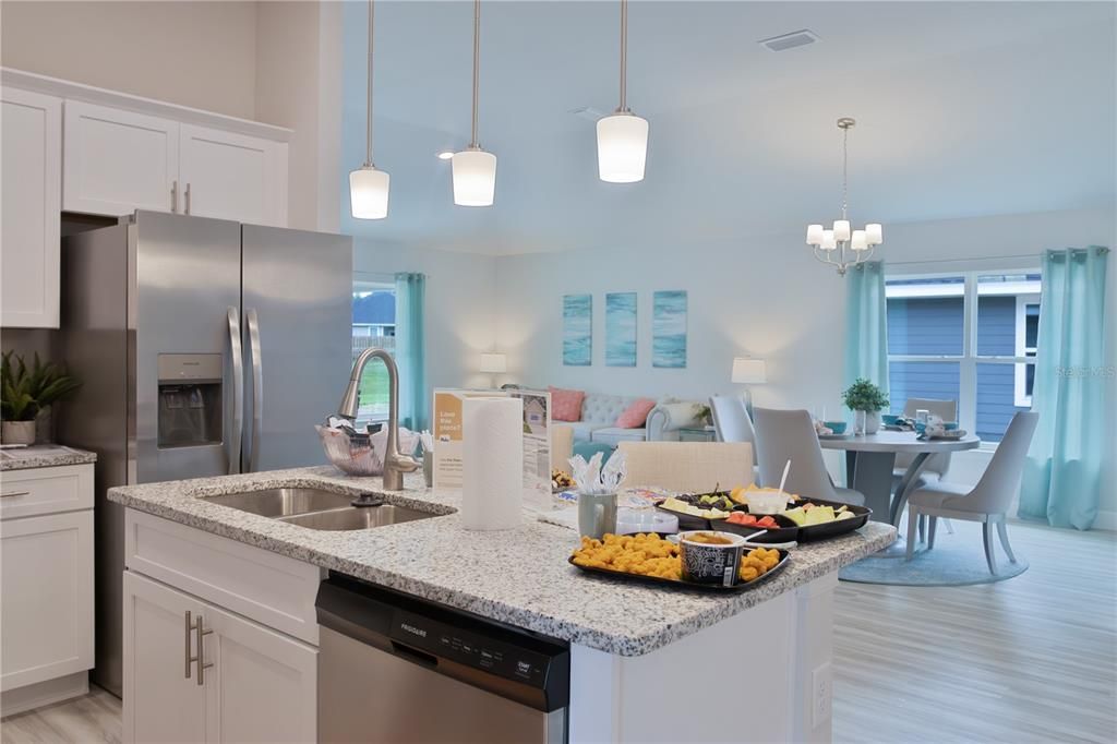 Chandelier, Dining room, Interior, Kitchen, Living room, Pendant Lights, Stainless Steel Appliances, Water, Wood Texture Flooring