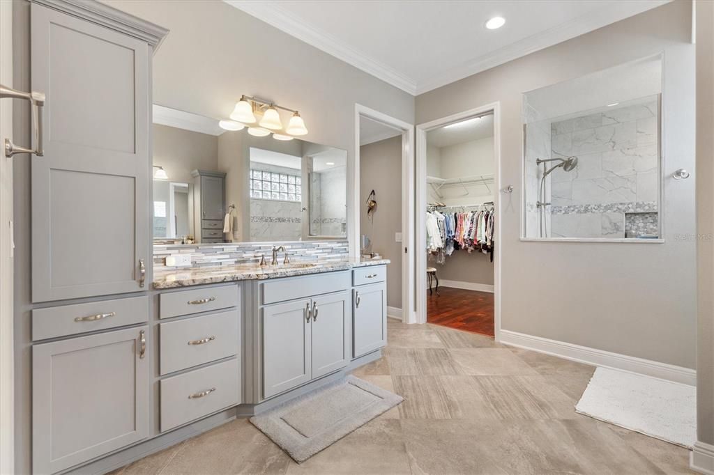 Bathroom, Dual Sink Vanities, Interior, Marble Walls, Recessed Lighting, Walk-in Closets, Wood Texture Flooring