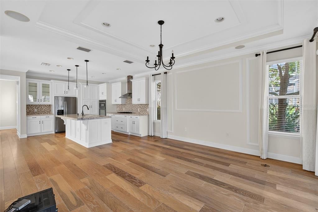 Chandelier, Interior, Kitchen, Pendant Lights, Recessed Lighting, Stainless Steel Appliances, Wood Texture Flooring