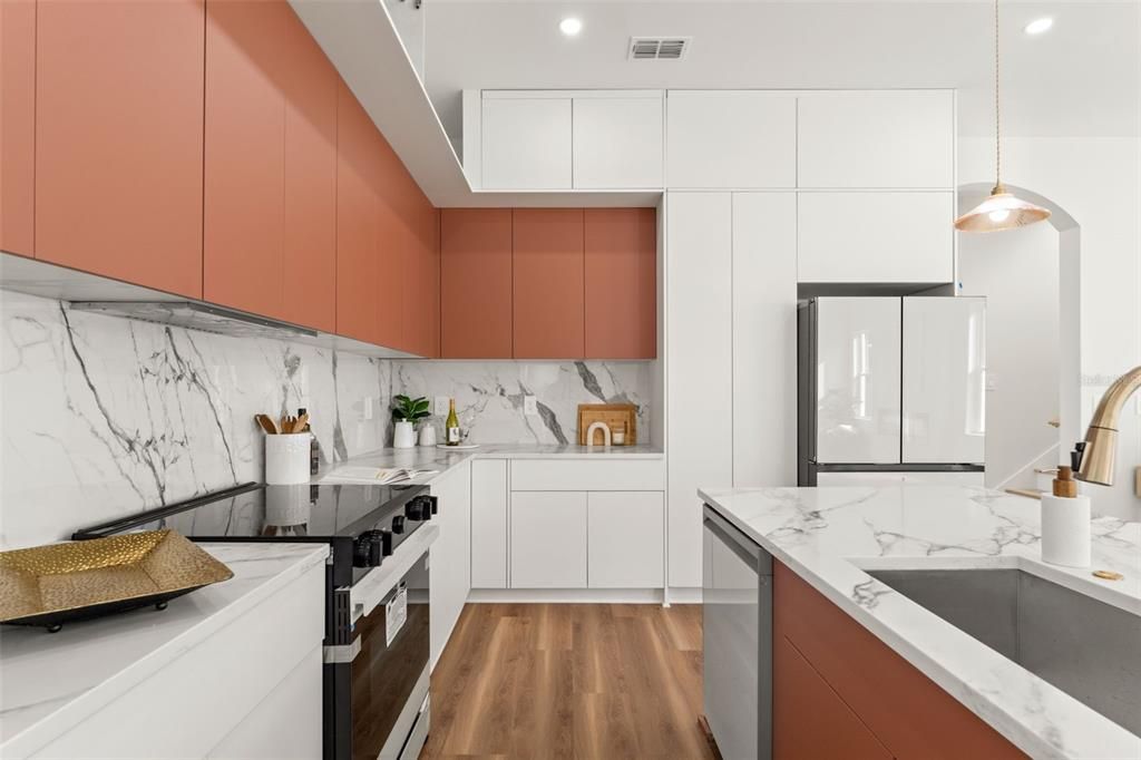 Interior, Kitchen, Marble Walls, Pendant Lights, Recessed Lighting, Stainless Steel Appliances, Wood Texture Flooring