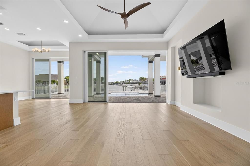 Chandelier, Empty room, Interior, Recessed Lighting, Water, Wood Texture Flooring