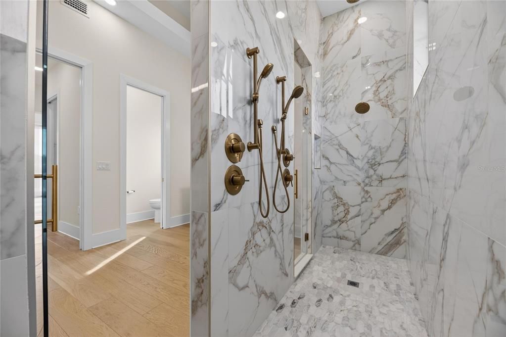 Bathroom, Glass Shower, Interior, Marble Walls, Recessed Lighting, Wood Texture Flooring