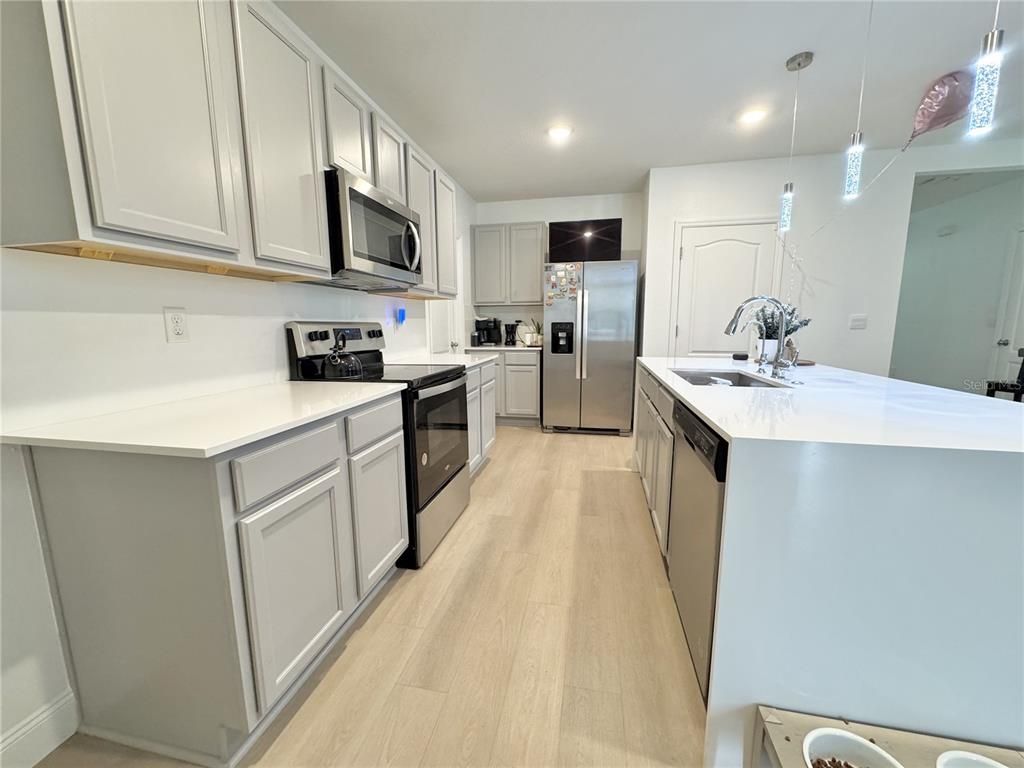 Interior, Kitchen, Pendant Lights, Recessed Lighting, Stainless Steel Appliances, Wood Texture Flooring