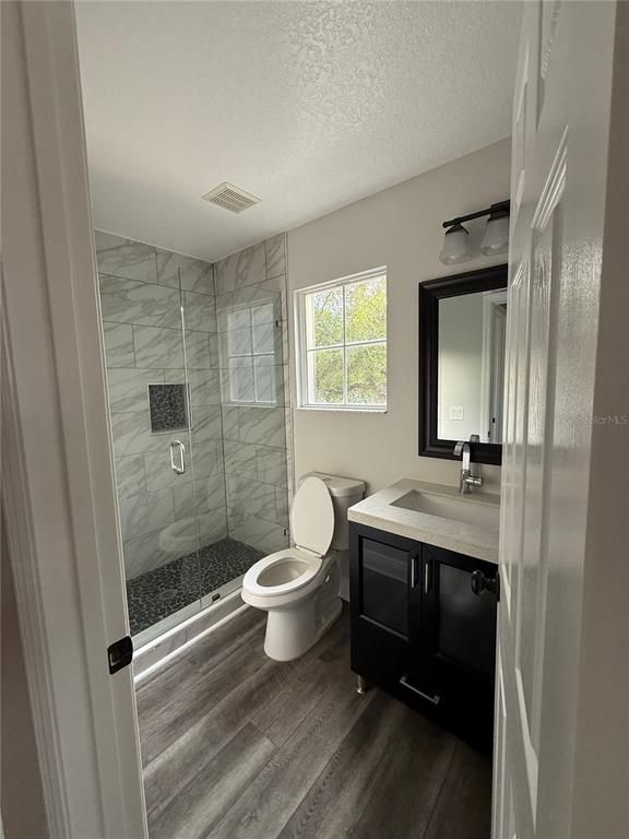 Bathroom, Glass Shower, Interior, Marble Walls, Wood Texture Flooring
