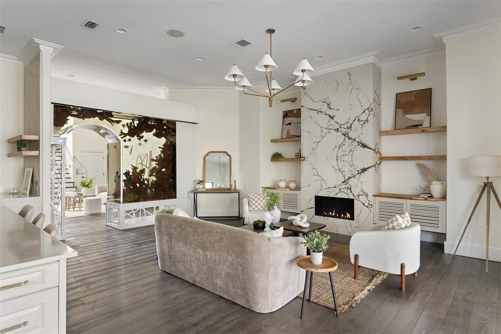 Chandelier, Fireplace, Interior, Living room, Marble Walls, Recessed Lighting, Wood Texture Flooring