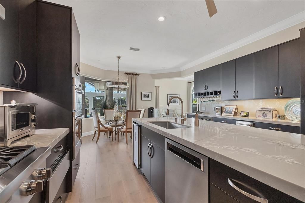 Dining room, Interior, Kitchen, Pendant Lights, Recessed Lighting, Stainless Steel Appliances, Wood Texture Flooring
