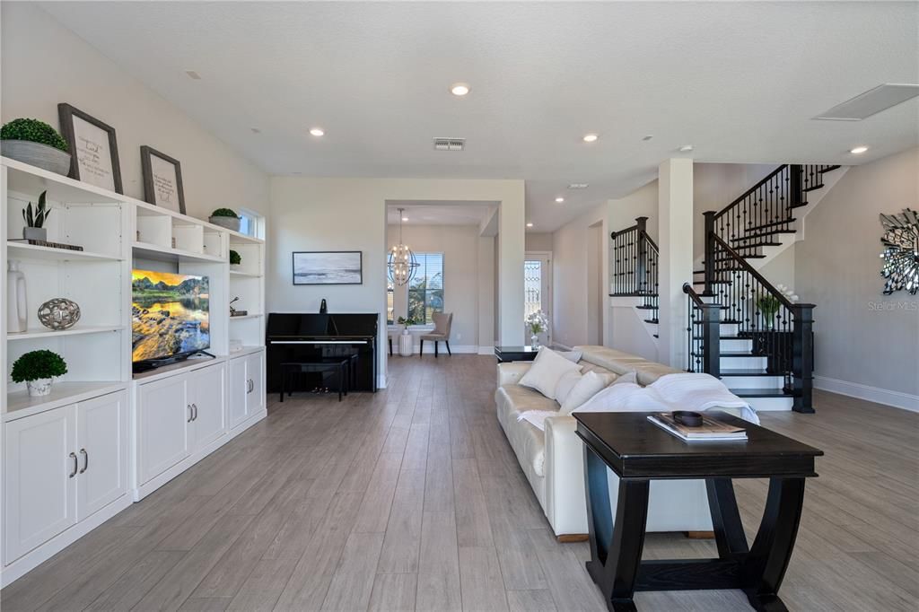 Chandelier, Dining room, Interior, Living room, Pendant Lights, Piano, Recessed Lighting, Wood Texture Flooring