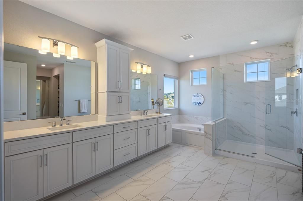 Bathroom, Dual Sink Vanities, Glass Shower, Interior, Marble, Marble Walls, Recessed Lighting