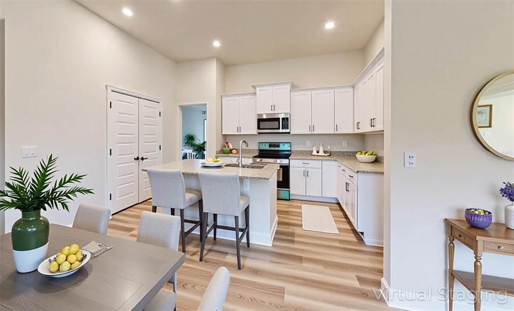 Dining room, Interior, Kitchen, Recessed Lighting, Stainless Steel Appliances, Wood Texture Flooring