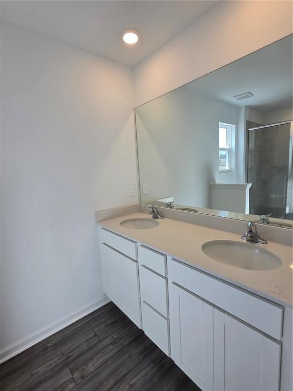 Bathroom, Dual Sink Vanities, Interior, Recessed Lighting, Wood Texture Flooring