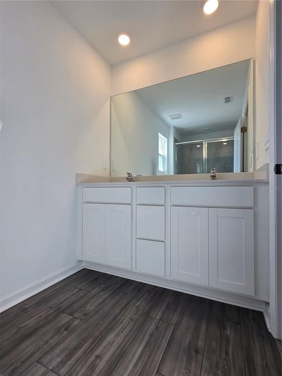 Bathroom, Dual Sink Vanities, Interior, Recessed Lighting, Wood Texture Flooring