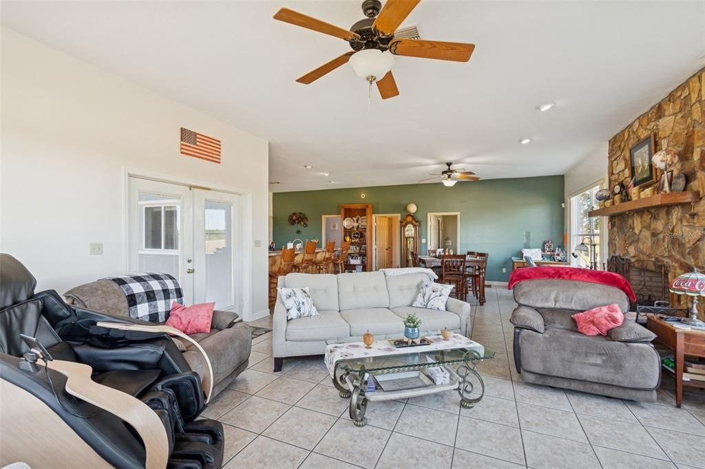 Dining room, Fireplace, Interior, Living room, Recessed Lighting, Stone Walls