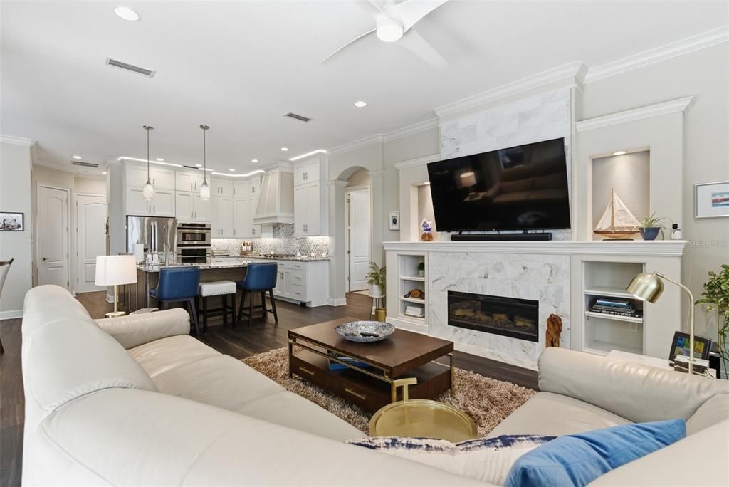 Dining room, Fireplace, Interior, Kitchen, Living room, Pendant Lights, Recessed Lighting, Stainless Steel Appliances, Wood Texture Flooring