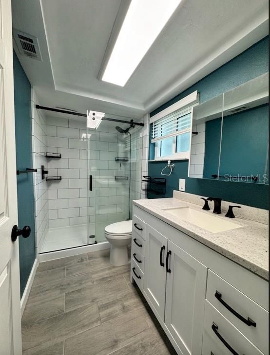 Bathroom, Dual Sink Vanities, Glass Shower, Interior, Wood Texture Flooring