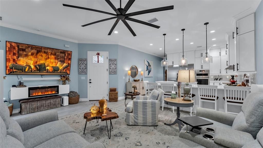 Dining room, Fireplace, Interior, Kitchen, Living room, Pendant Lights, Recessed Lighting, Stainless Steel Appliances, Wood Texture Flooring