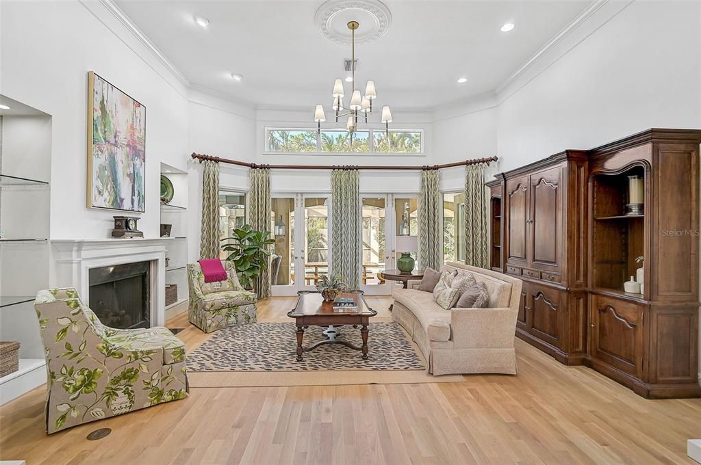 Chandelier, Fireplace, Interior, Living room, Recessed Lighting, Wood Texture Flooring