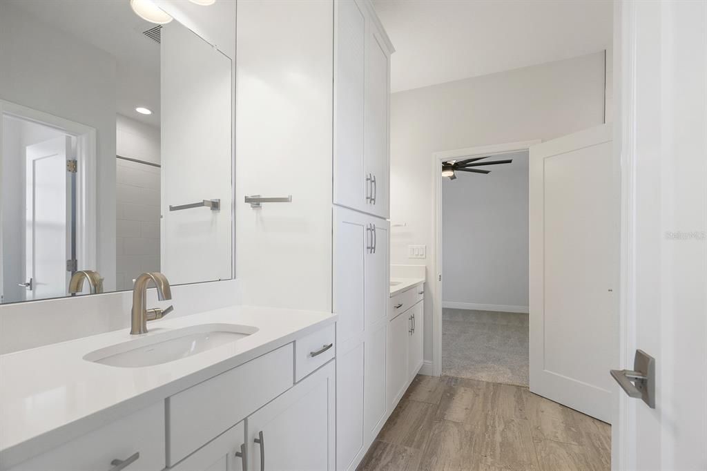 Bathroom, Dual Sink Vanities, Interior, Recessed Lighting, Wood Texture Flooring