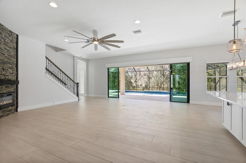 Empty room, Fireplace, Interior, Pendant Lights, Recessed Lighting, Wood Texture Flooring