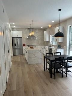 Dining room, Interior, Kitchen, Pendant Lights, Recessed Lighting, Stainless Steel Appliances, Wood Texture Flooring