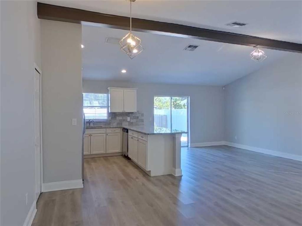 Empty room, Interior, Kitchen, Pendant Lights, Recessed Lighting, Wooden Beams, Wood Texture Flooring