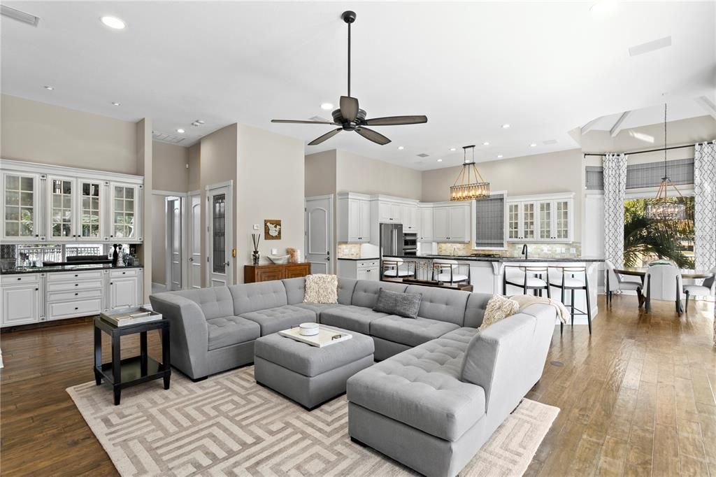 Chandelier, Dining room, Interior, Kitchen, Living room, Pendant Lights, Recessed Lighting, Stainless Steel Appliances, Wood Texture Flooring