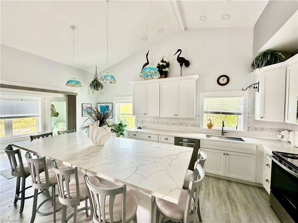 Dining room, Interior, Kitchen, Pendant Lights, Stainless Steel Appliances, Wood Texture Flooring