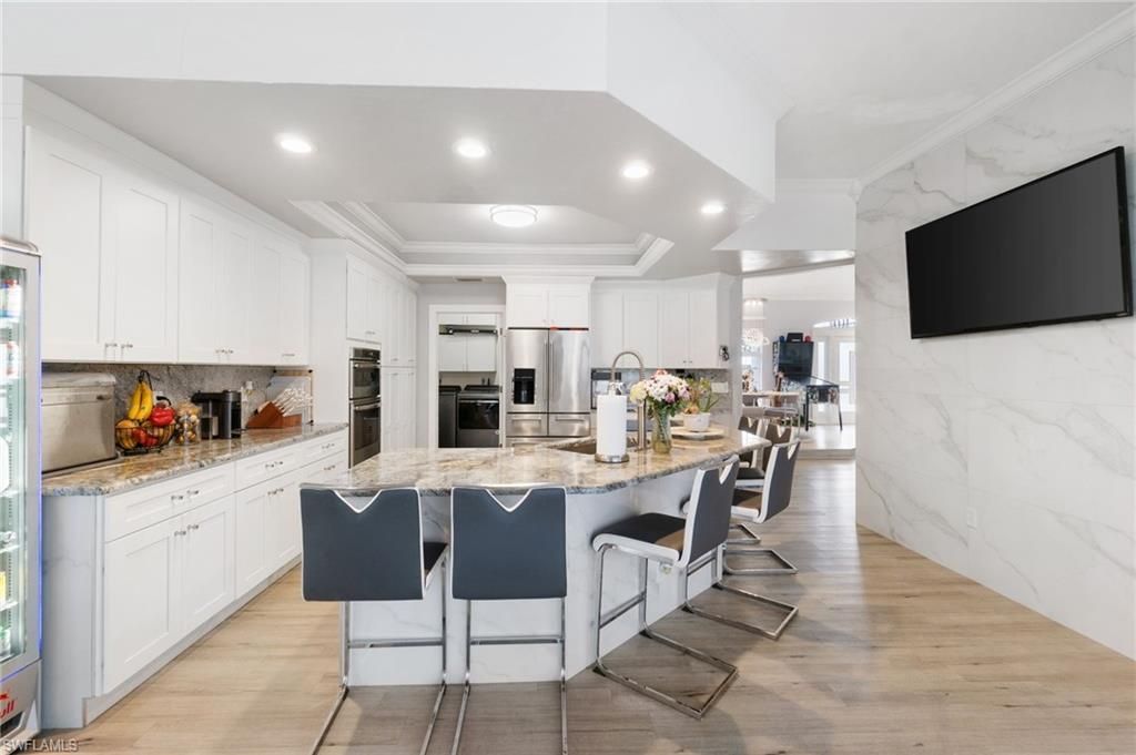 Interior, Kitchen, Marble Walls, Recessed Lighting, Stainless Steel Appliances, Wood Texture Flooring