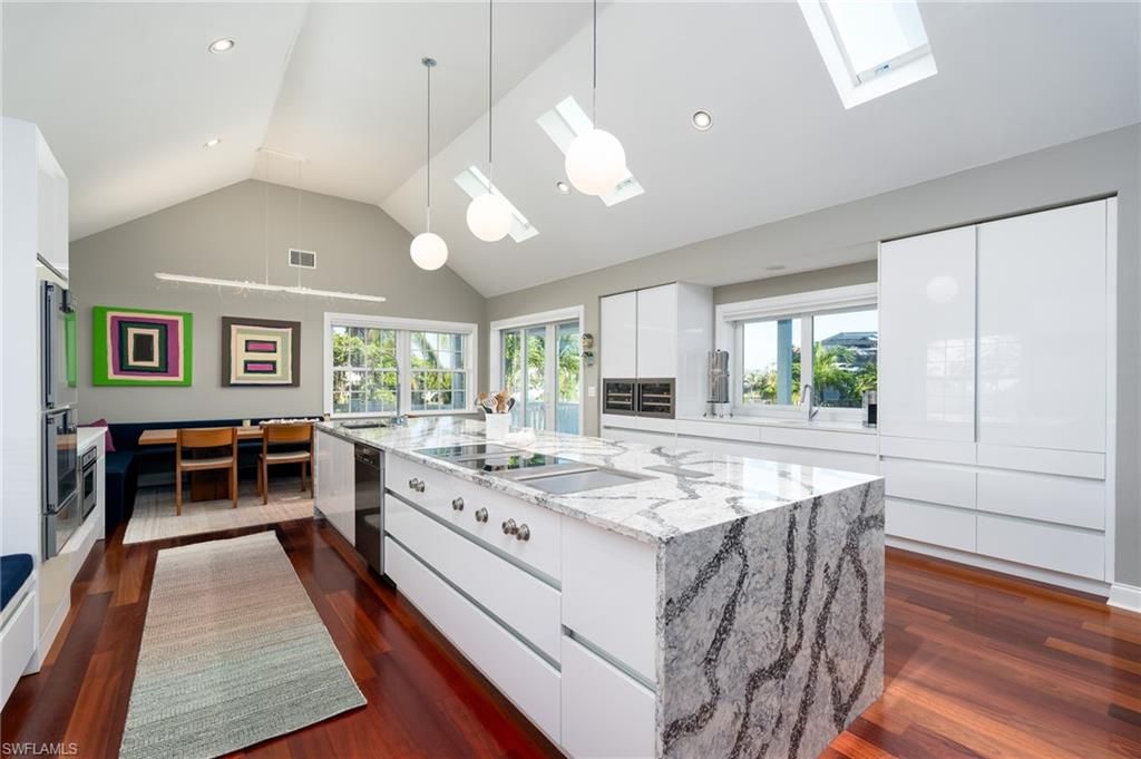 Dining room, Interior, Kitchen, Pendant Lights, Recessed Lighting, Stainless Steel Appliances, Wood Texture Flooring