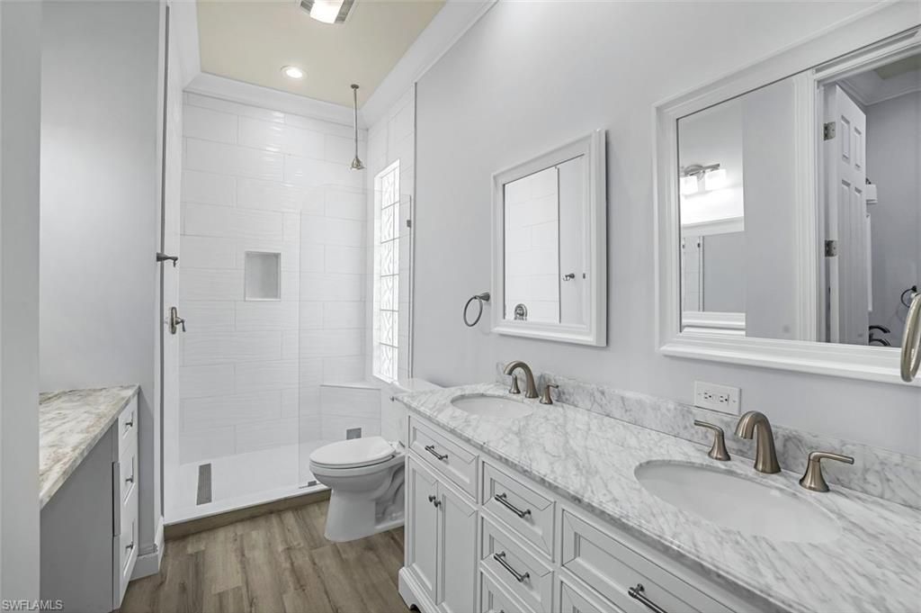 Bathroom, Dual Sink Vanities, Interior, Recessed Lighting, Wood Texture Flooring