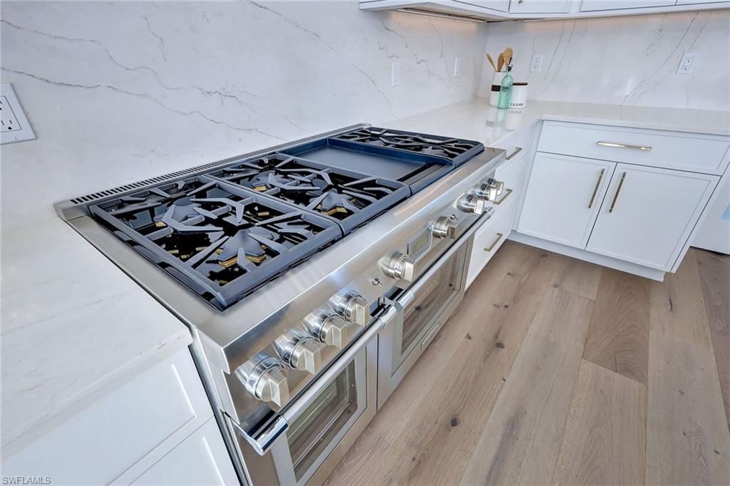 Interior, Kitchen, Marble Walls, Stainless Steel Appliances, Wood Texture Flooring