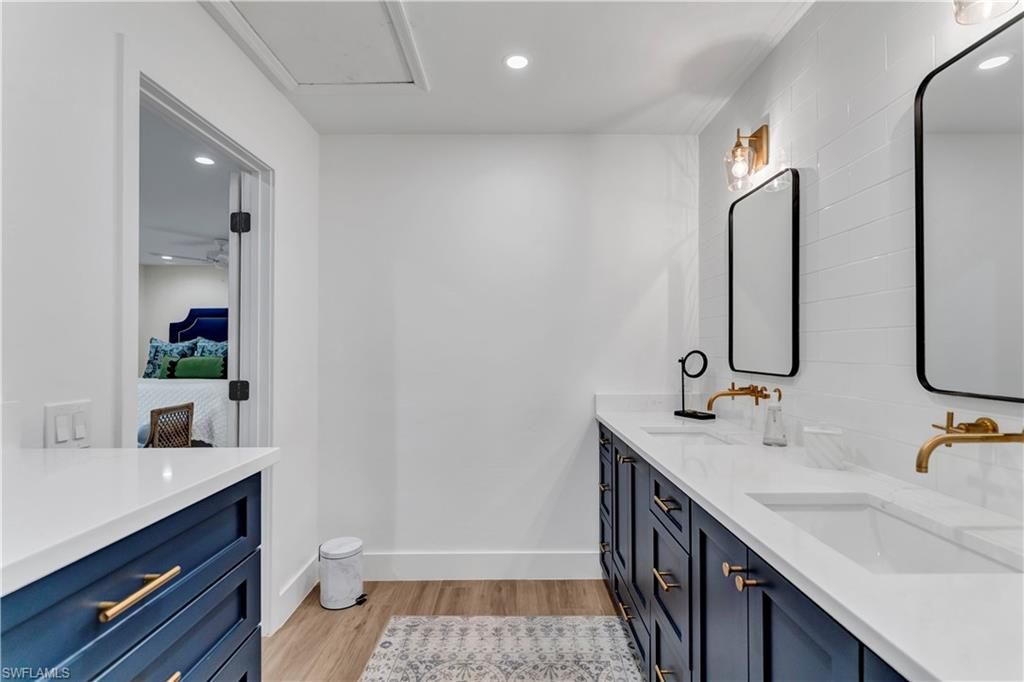 Bathroom, Dual Sink Vanities, Interior, Recessed Lighting, Wood Texture Flooring