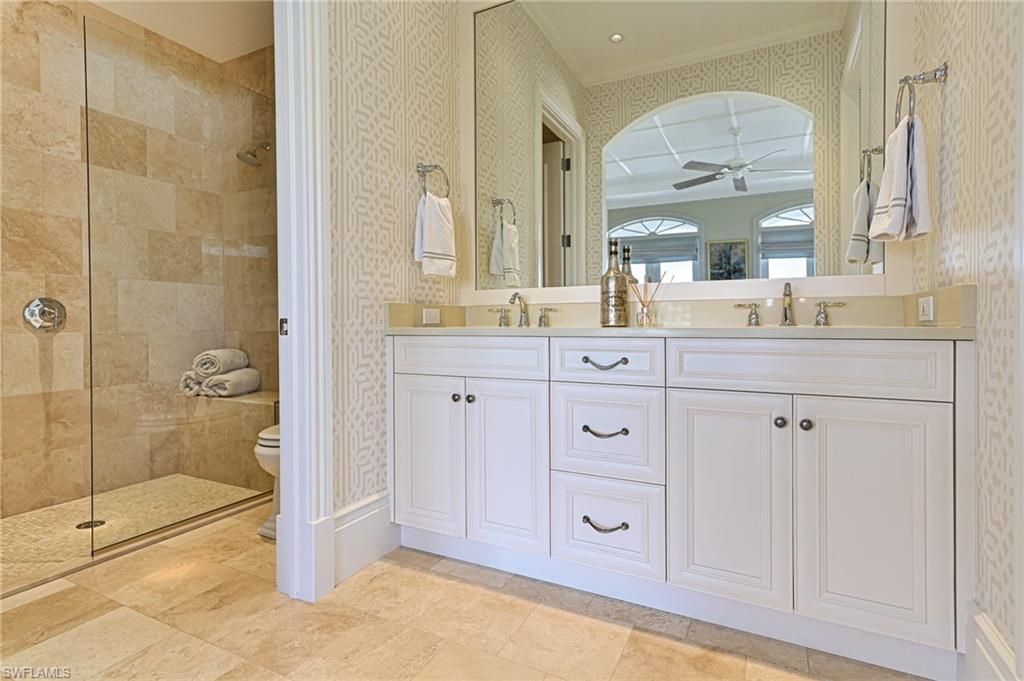 Bathroom, Dual Sink Vanities, Glass Shower, Interior, Recessed Lighting, Stone Walls