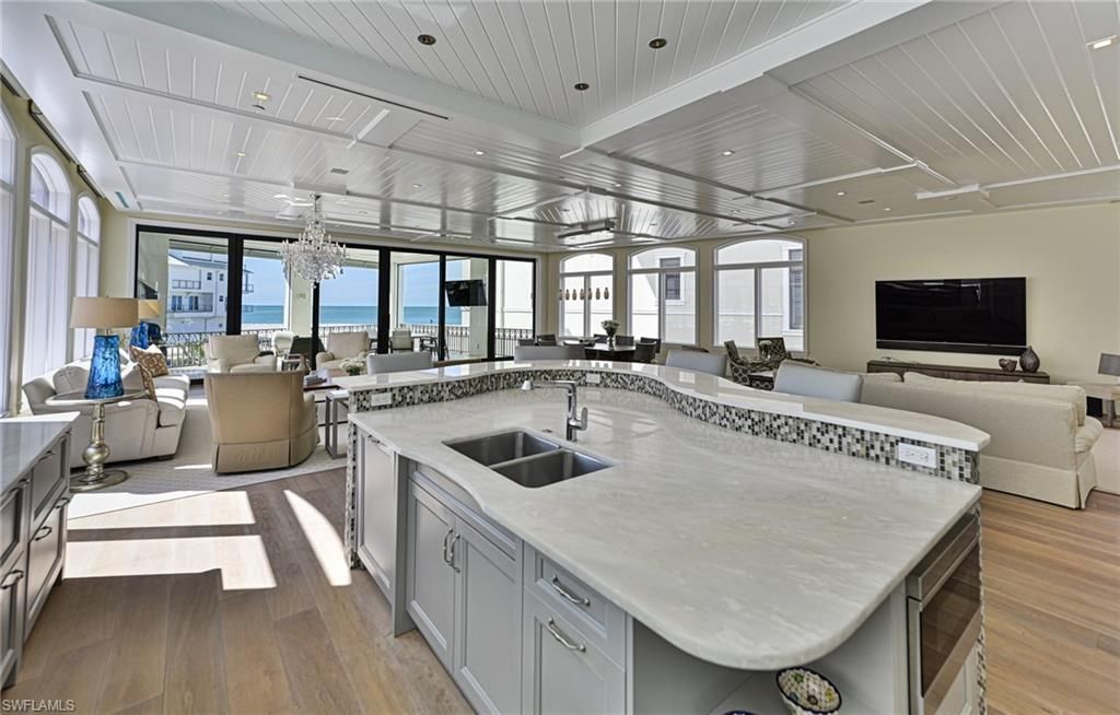 Chandelier, Dining room, Interior, Kitchen, Living room, Recessed Lighting, Water, Wood Texture Flooring