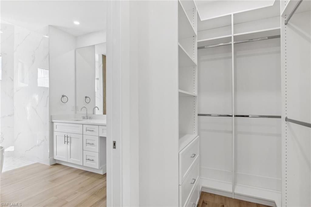Bathroom, Interior, Marble Walls, Recessed Lighting, Walk-in Closets, Wood Texture Flooring