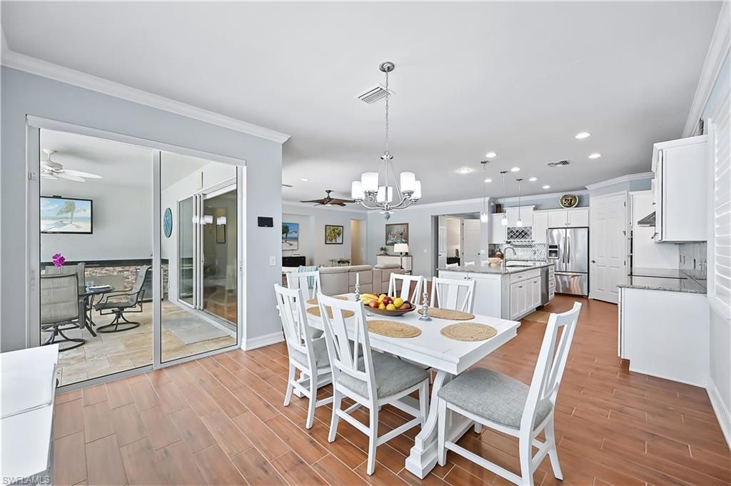 Dining room, Interior, Kitchen, Pendant Lights, Recessed Lighting, Stainless Steel Appliances, Wood Texture Flooring