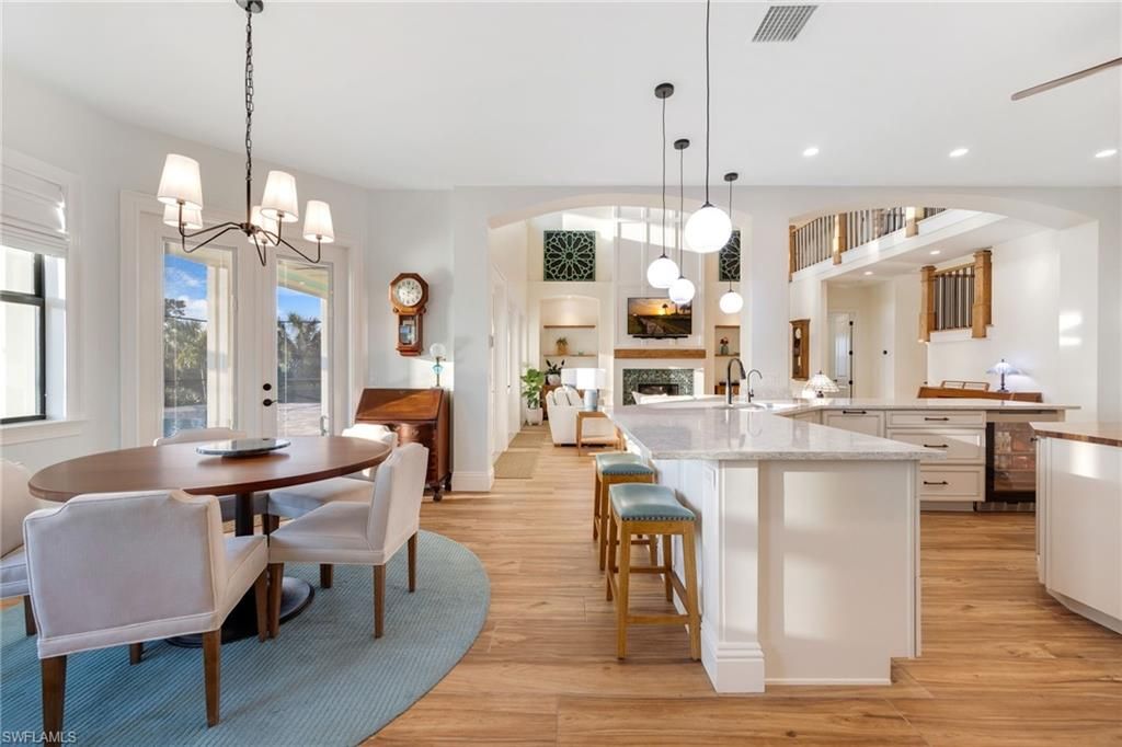 Chandelier, Dining room, Fireplace, Interior, Kitchen, Pendant Lights, Recessed Lighting, Wood Texture Flooring