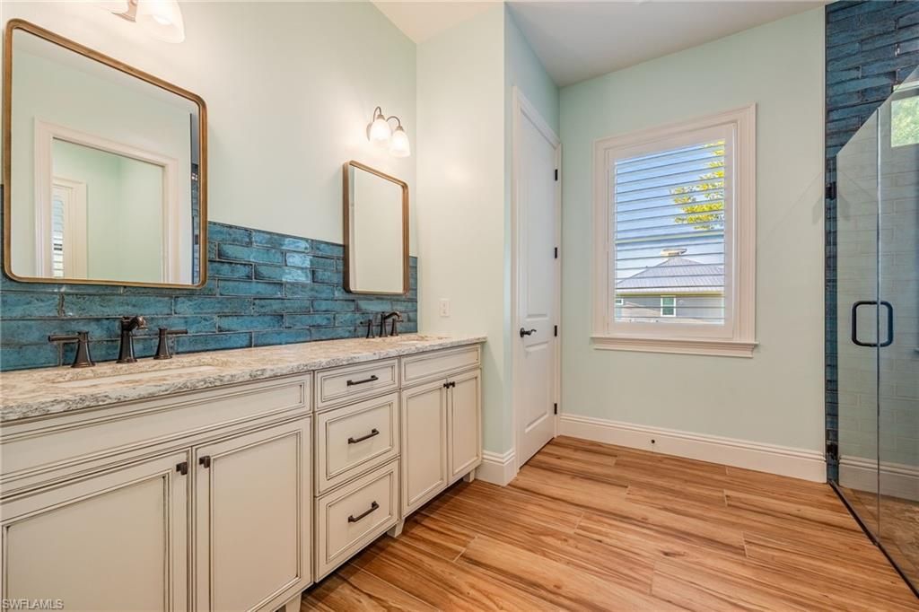 Bathroom, Dual Sink Vanities, Glass Shower, Interior, Wood Texture Flooring