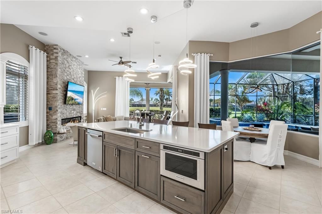 Dining room, Fireplace, Glass Ceilings, Interior, Kitchen, Pendant Lights, Recessed Lighting, Stainless Steel Appliances, Stone Walls