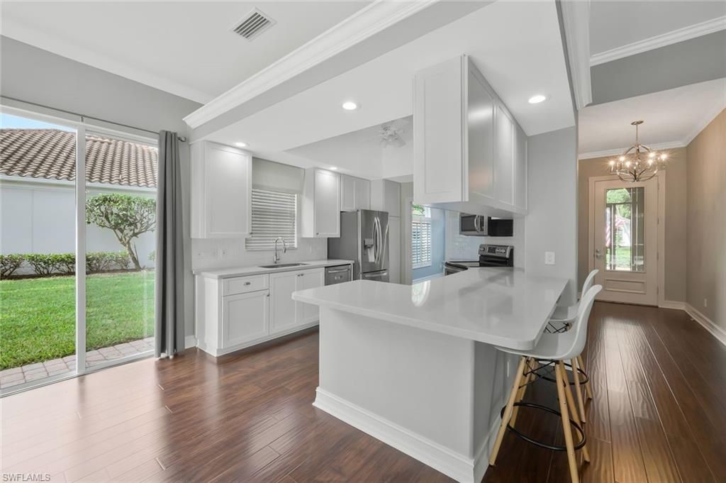 Chandelier, Interior, Kitchen, Recessed Lighting, Stainless Steel Appliances, Wood Texture Flooring