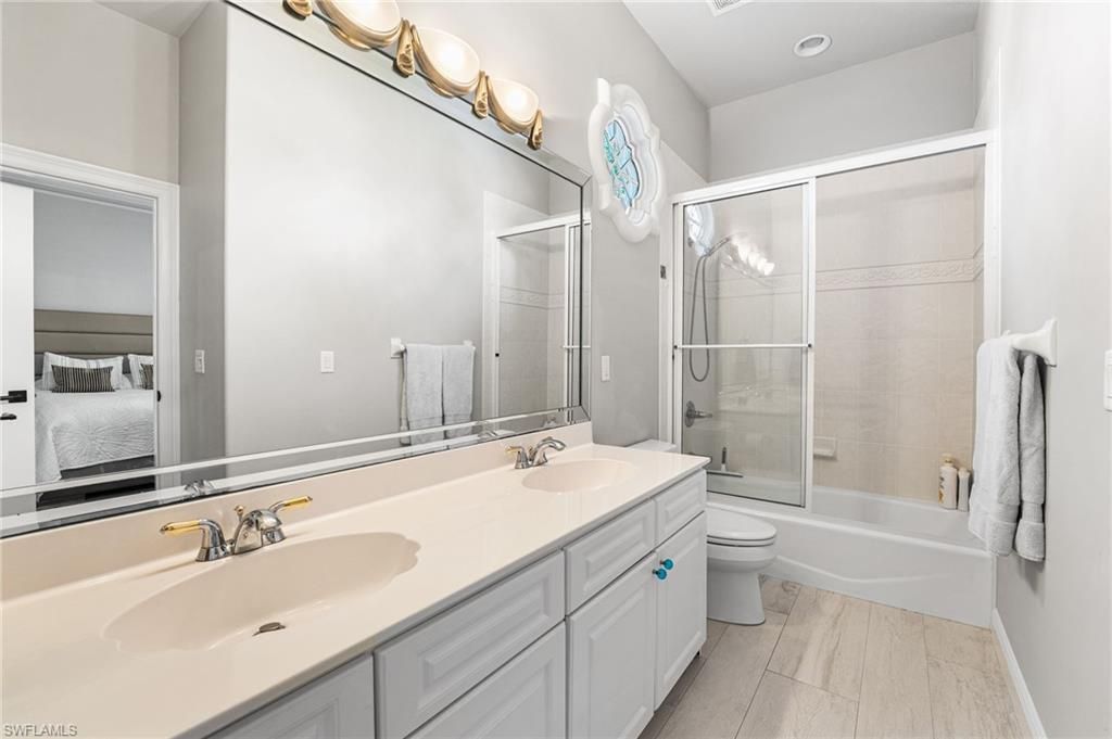 Bathroom, Dual Sink Vanities, Glass Shower, Interior, Recessed Lighting, Wood Texture Flooring
