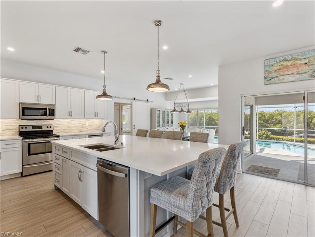 Interior, Kitchen, Pendant Lights, Recessed Lighting, Stainless Steel Appliances, Wood Texture Flooring