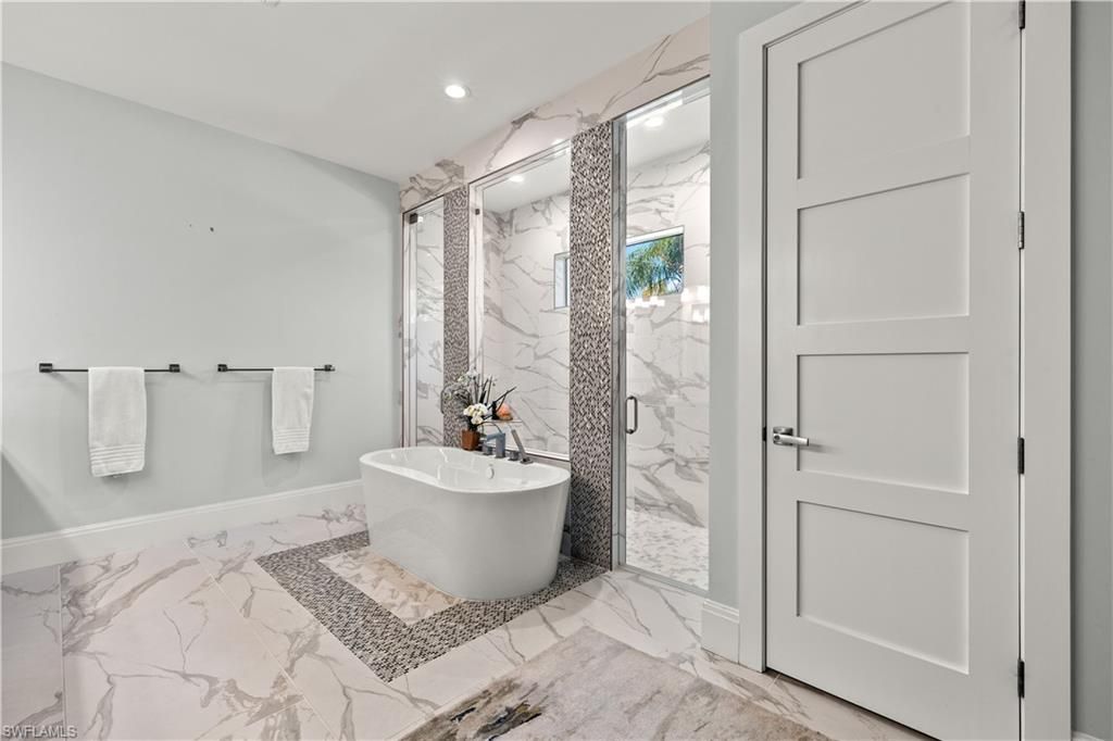 Bathroom, Free Standing Baths, Glass Shower, Interior, Marble, Marble Walls, Recessed Lighting