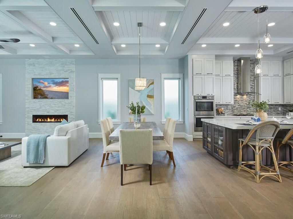 Dining room, Fireplace, Interior, Kitchen, Living room, Pendant Lights, Recessed Lighting, Stainless Steel Appliances, Stone Walls, Wood Texture Flooring
