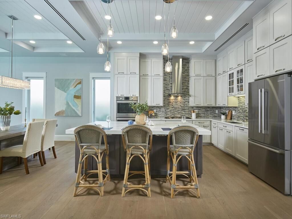 Dining room, Interior, Kitchen, Pendant Lights, Recessed Lighting, Stainless Steel Appliances, Wood Texture Flooring