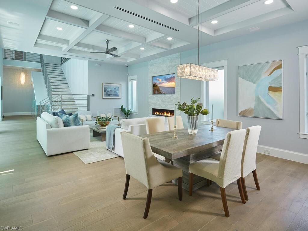 Chandelier, Dining room, Fireplace, Interior, Living room, Pendant Lights, Recessed Lighting, Wood Texture Flooring