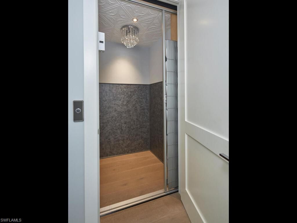 Chandelier, Elevator, Interior, Wood Texture Flooring