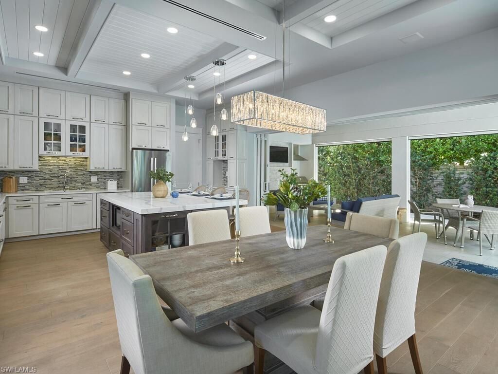 Chandelier, Dining room, Interior, Kitchen, Pendant Lights, Recessed Lighting, Stainless Steel Appliances, Wood Texture Flooring